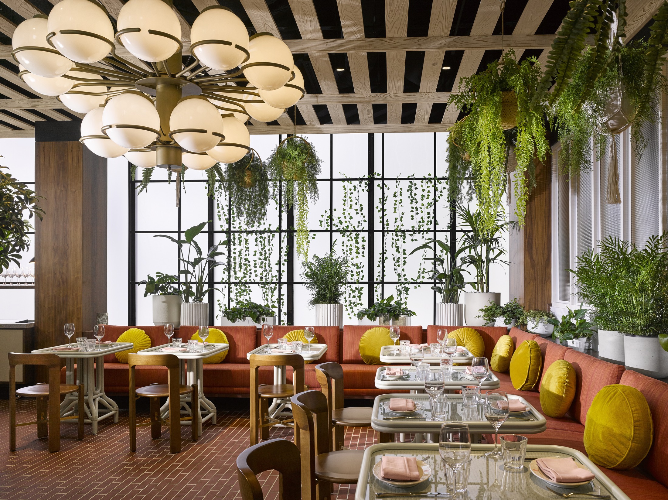 Rosalie Sunroom - filled with plants, seating and large windows